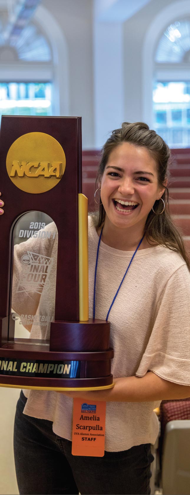 UVA Swag - Woman holding NCAA trophy