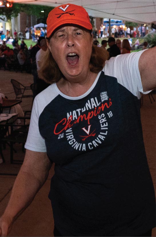 UVA Swag - Woman with championship shirt and hat