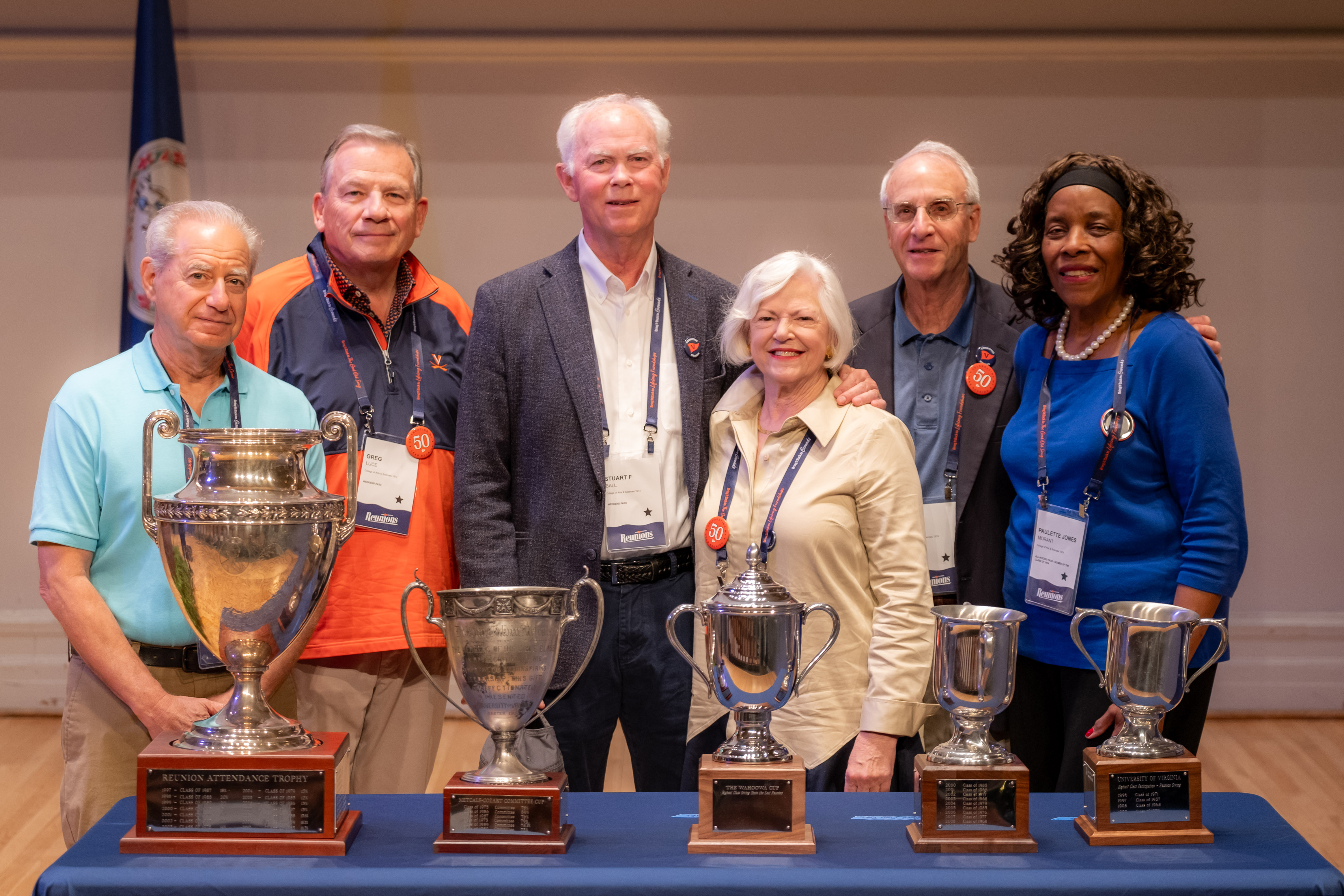 Class of 1974 volunteers with trophies