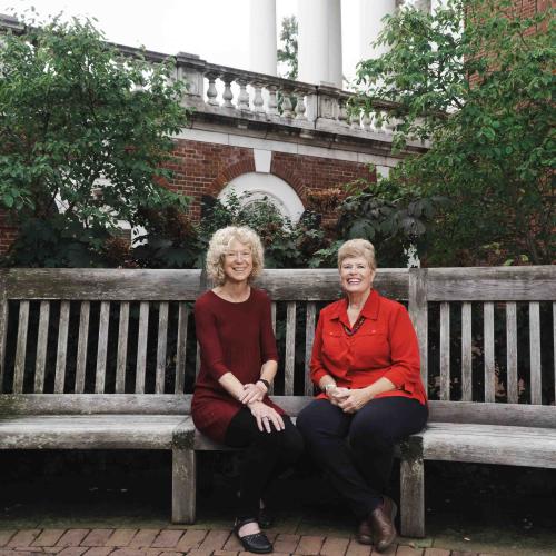 Marti Snell and Annette Porter sitting on a bench