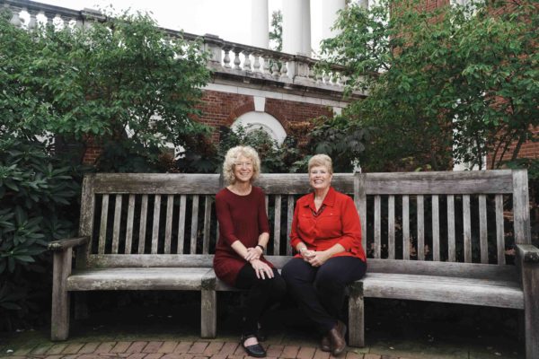 Marti Snell and Annette Porter sitting on a bench