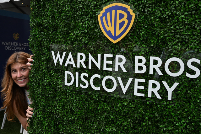 Amanda Upson looking around a bush.